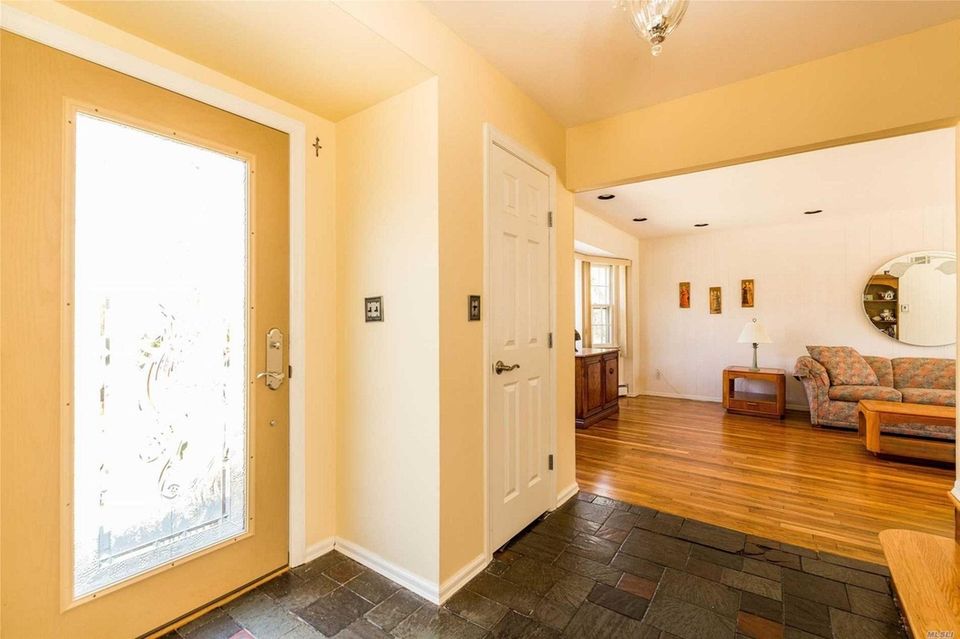 Beyond the entry foyer in this Huntington Colonial