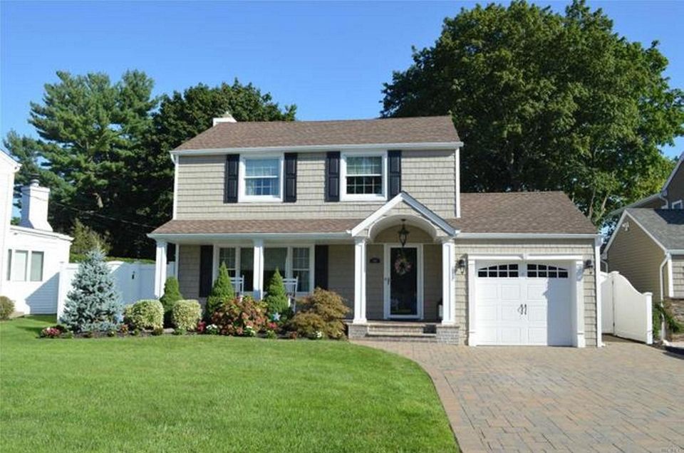 This North Merrick Colonial has three bedrooms and