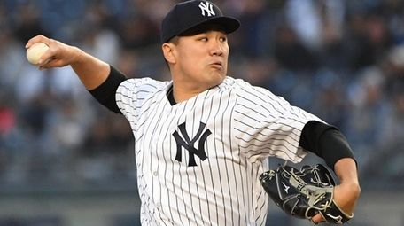 Yankees starting pitcher Masahiro Tanaka delivers a pitch