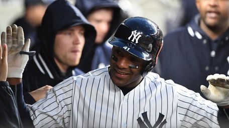 Yankees third baseman Miguel Andujar is greeted in