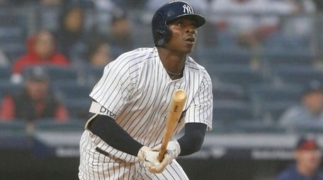 Didi Gregorius of the Yankees follows through on