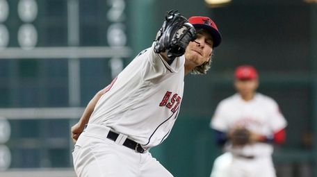 Astros relief pitcher Ashur Tolliver delivers a pitch