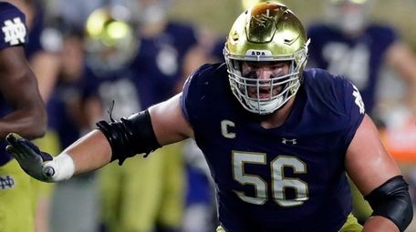 Notre Dame offensive lineman Quenton Nelson defends the