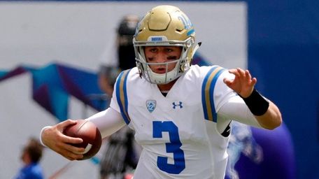 UCLA quarterback Josh Rosen scrambles against Memphis on