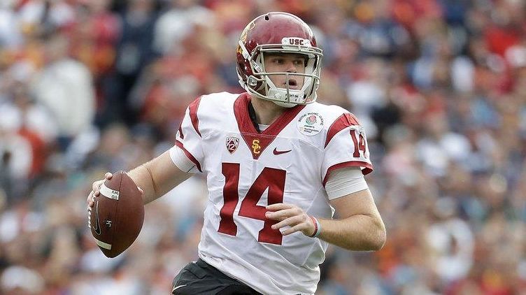 USC quarterback Sam Darnold avoids a sack by