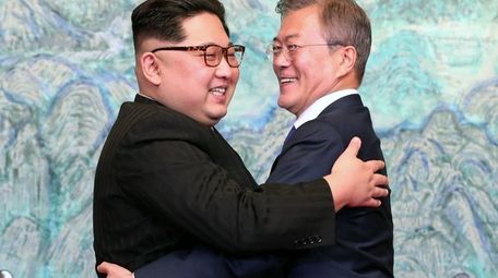 North Korean leader Kim Jong Un, left, and