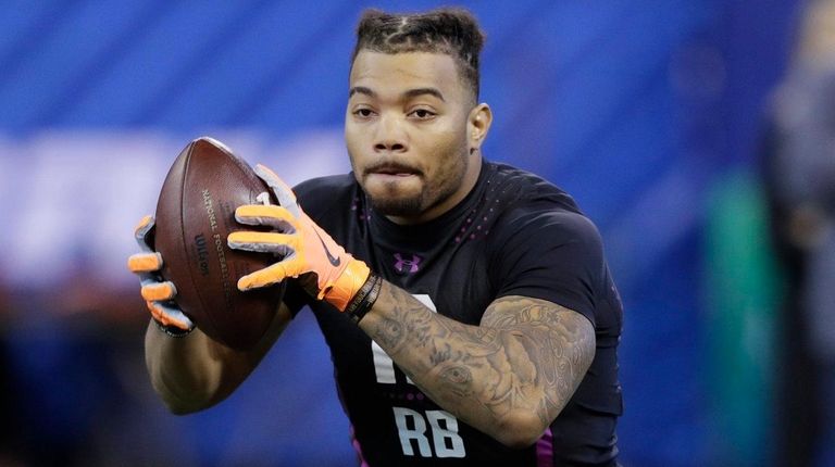 LSU running back Derrius Guice runs a drill