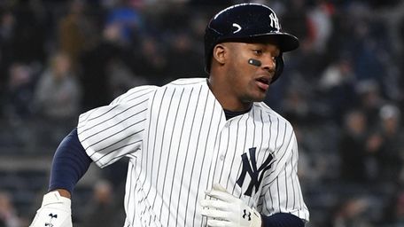Yankees third baseman Miguel Andujar runs on his