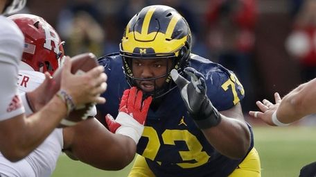 Michigan defensive lineman Maurice Hurst goes up against