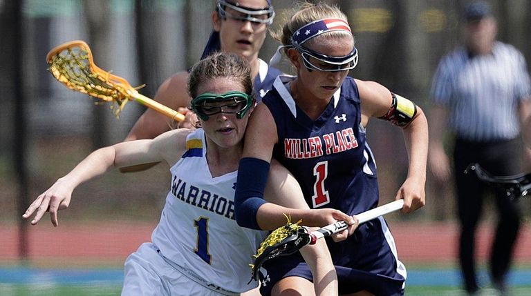Comsewogue's Hannah Dorney controls the loose ball against
