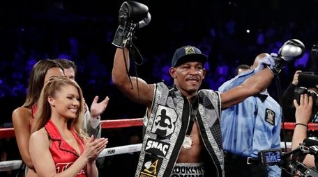 Daniel Jacobs celebrates after his win in a