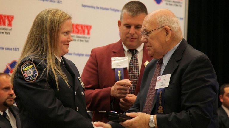 Thomas Cuff Jr., right, at a ceremony in