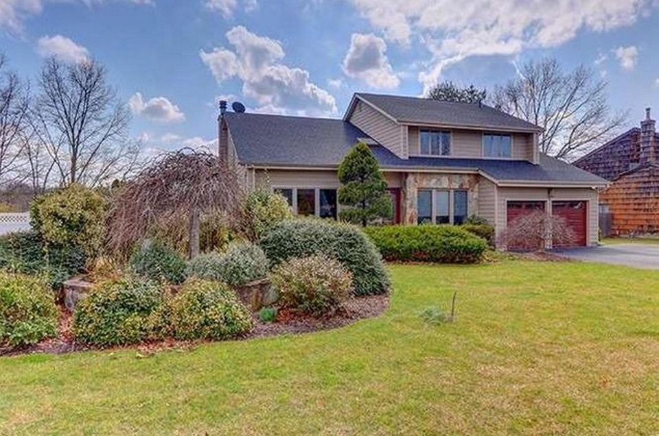 This Commack Colonial includes four bedrooms and 2
