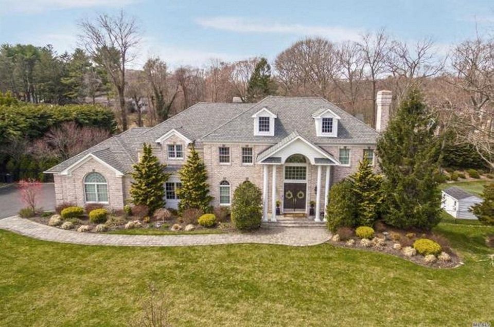 This Northport Colonial includes five bedrooms and 4