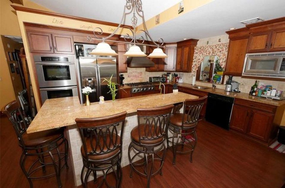 The eat-in kitchen in this West Islip high-ranch