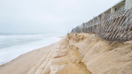 Erosion along an artificial dune made from sandbags