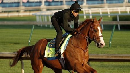 Kentucky Derby hopeful Justify runs during a morning