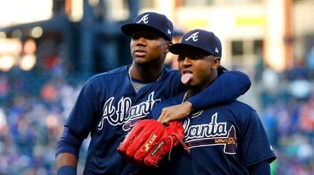 Ronald Acuna Jr., left, and Ozzie Albies of