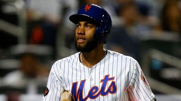 Amed Rosario of the Mets strikes out in