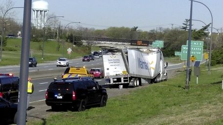 A Walmart tractor trailer hit an overpass on