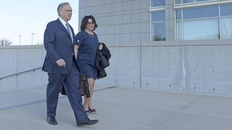 Edward and Linda Mangano arrive at federal court