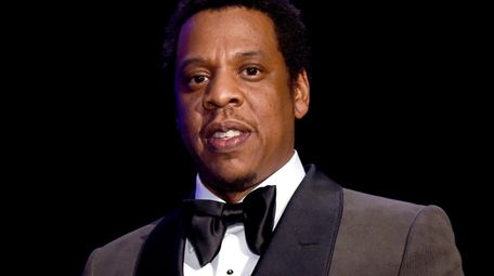 Jay-Z accepts the President's Merit Award at a
