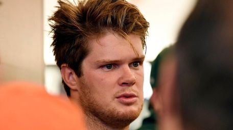 Sam Darnold talks to the media on day