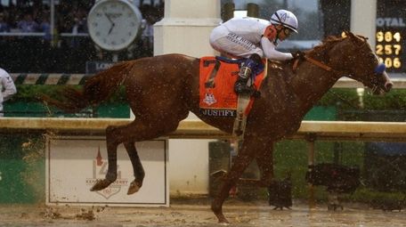 Mike Smith rides Justify to victory in the