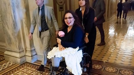 Sen. Tammy Duckworth, D-Ill., arrives at the Capitol
