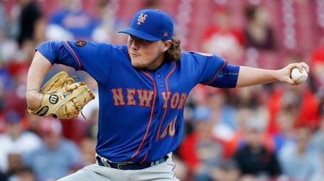 Mets starting pitcher P.J. Conlon throws in the