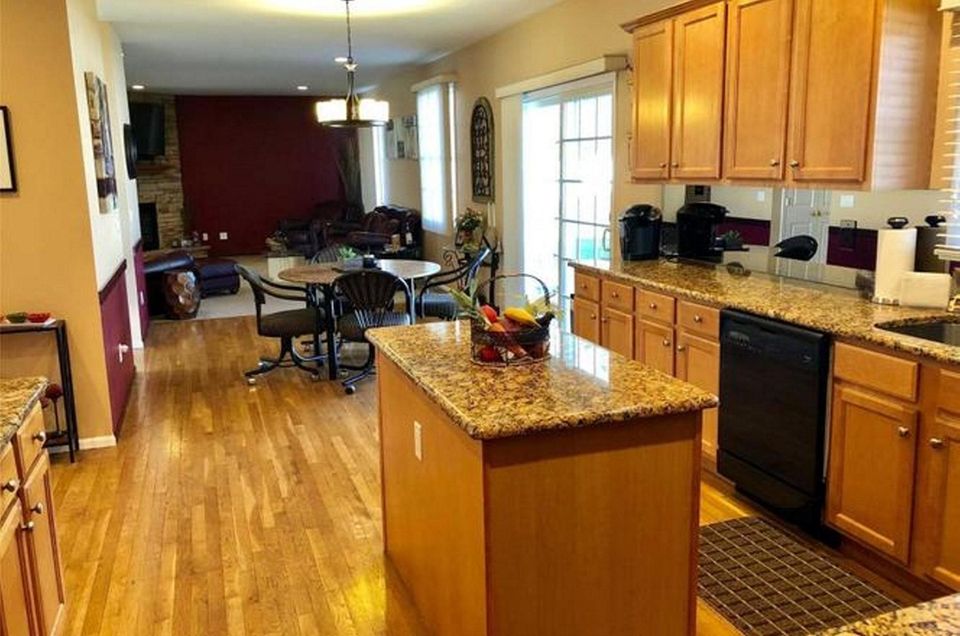 The granite kitchen in this St. James Colonial
