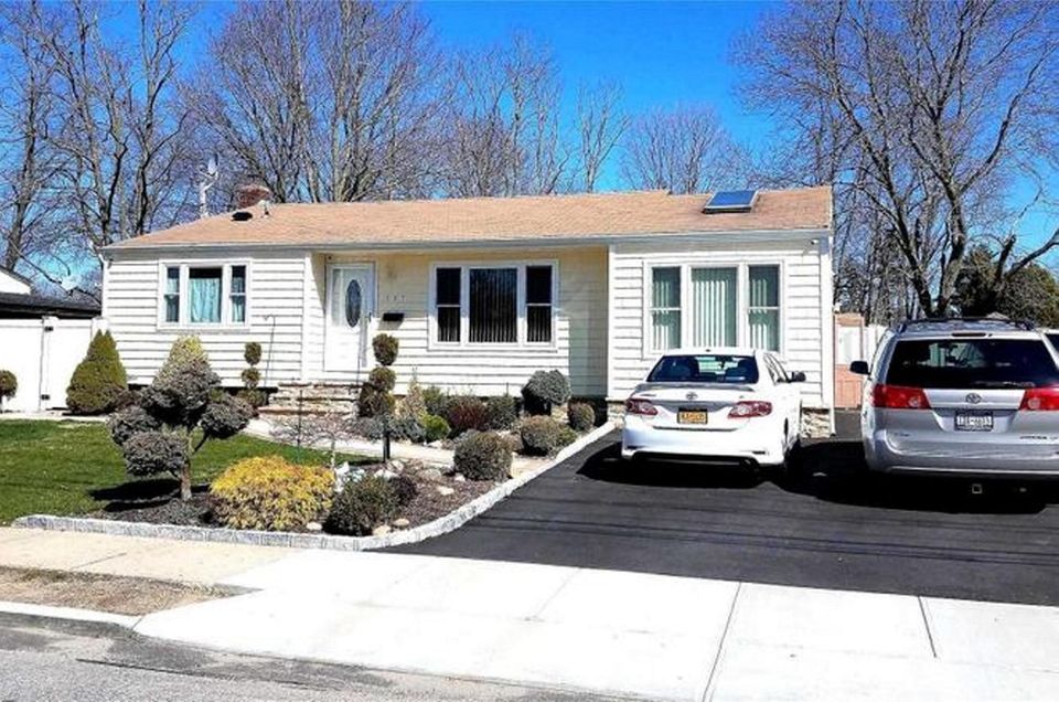 This Brentwood expanded-ranch includes three bedrooms and two
