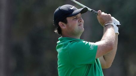 Patrick Reed hits from the 10th fairway during