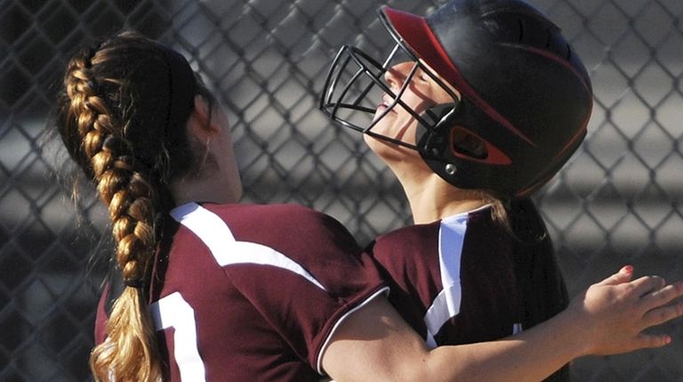 Mepham shortstop Kelsey Vandewater right, gets congratulated by