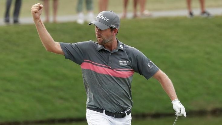 Webb Simpson celebrates an eagle shot on the