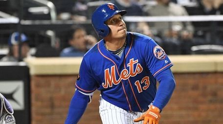 Asdrubal Cabrera watches his RBI triple against the