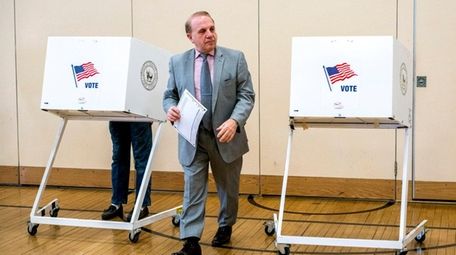 Denis Garbo, of Lindenhurst, votes at Lindenhurst's Harding
