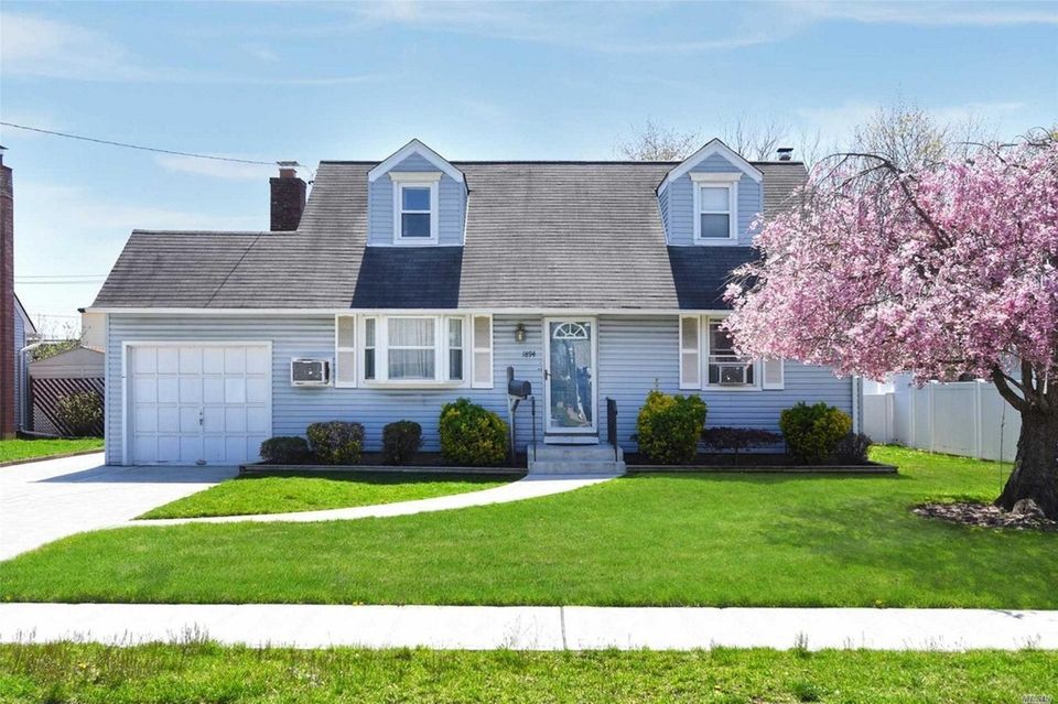 This East Meadow Cape includes four bedrooms and