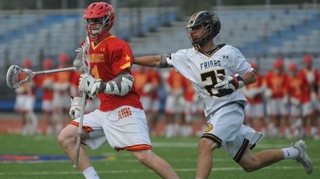 Aidan Byrnes of Chaminade, left, gets pressured by