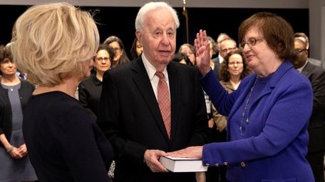 Barbara Underwood, right, takes the oath of office