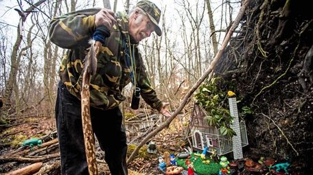 Andy Kuzma, of Levittown, shows the gnome house