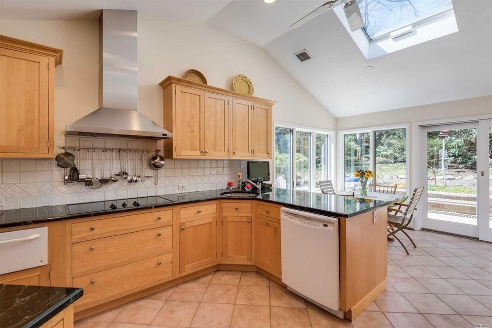 The expanded kitchen in this Centerport split-level opens