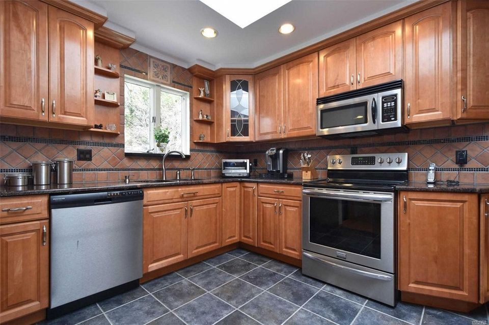 The kitchen in this Medford ranch features granite
