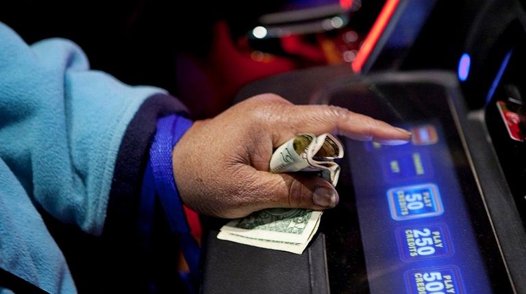 A woman holds onto her money as