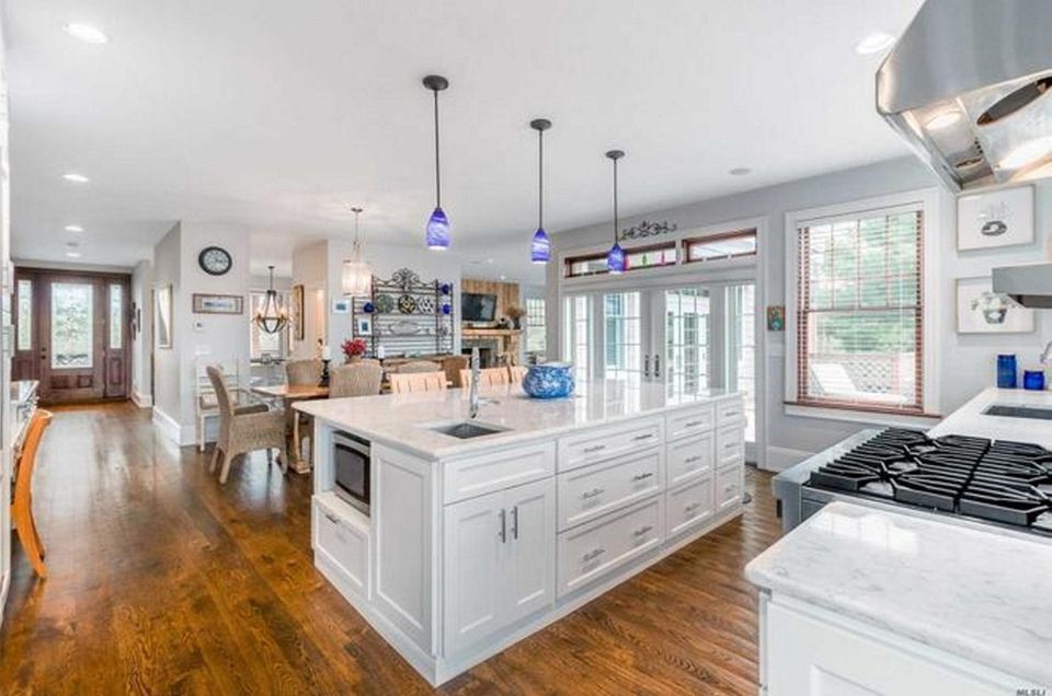 The eat-in kitchen in this Westhampton postmodern features
