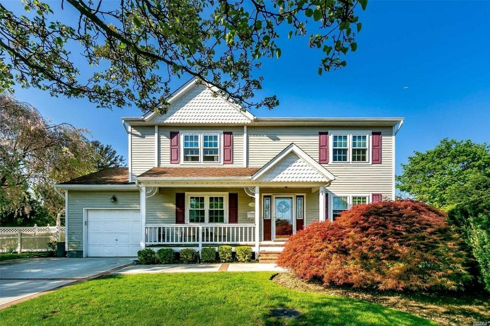 This Bethpage Colonial includes four bedrooms and 2