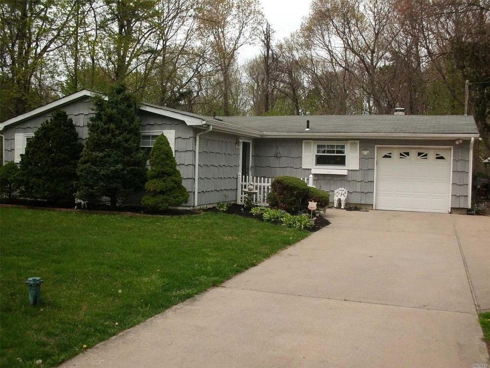 This Yaphank ranch includes three bedrooms and 1