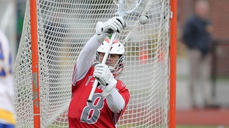 Connetquot's Andrew Pinto (8) makes a save in