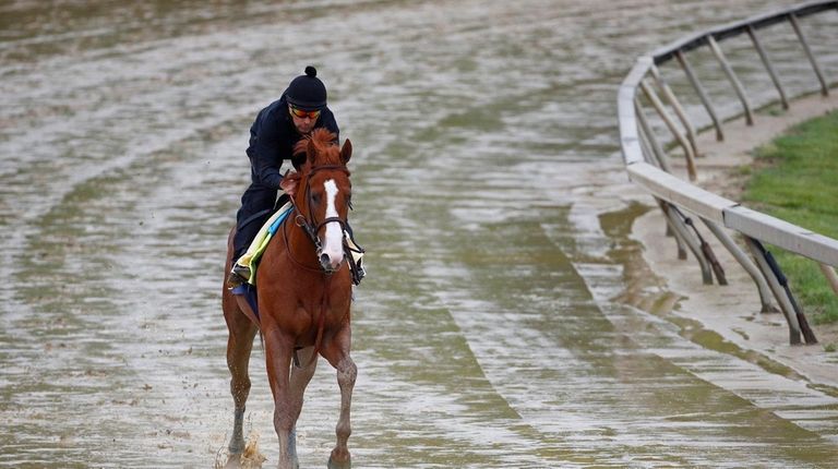 Kentucky Derby winner Justify, with exercise rider Humberto