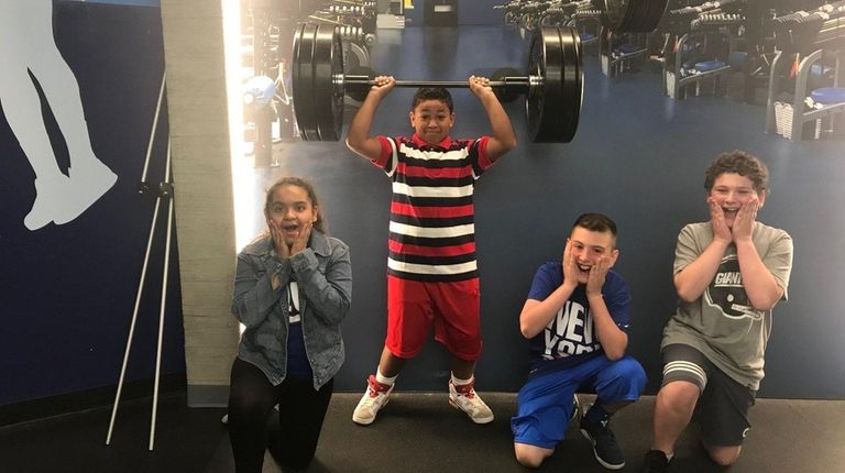 From left, Eve Arevalo, Jayvien Echevarria, Michael Standel